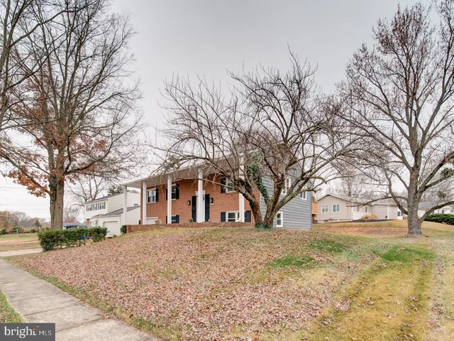 a front view of house with a trees