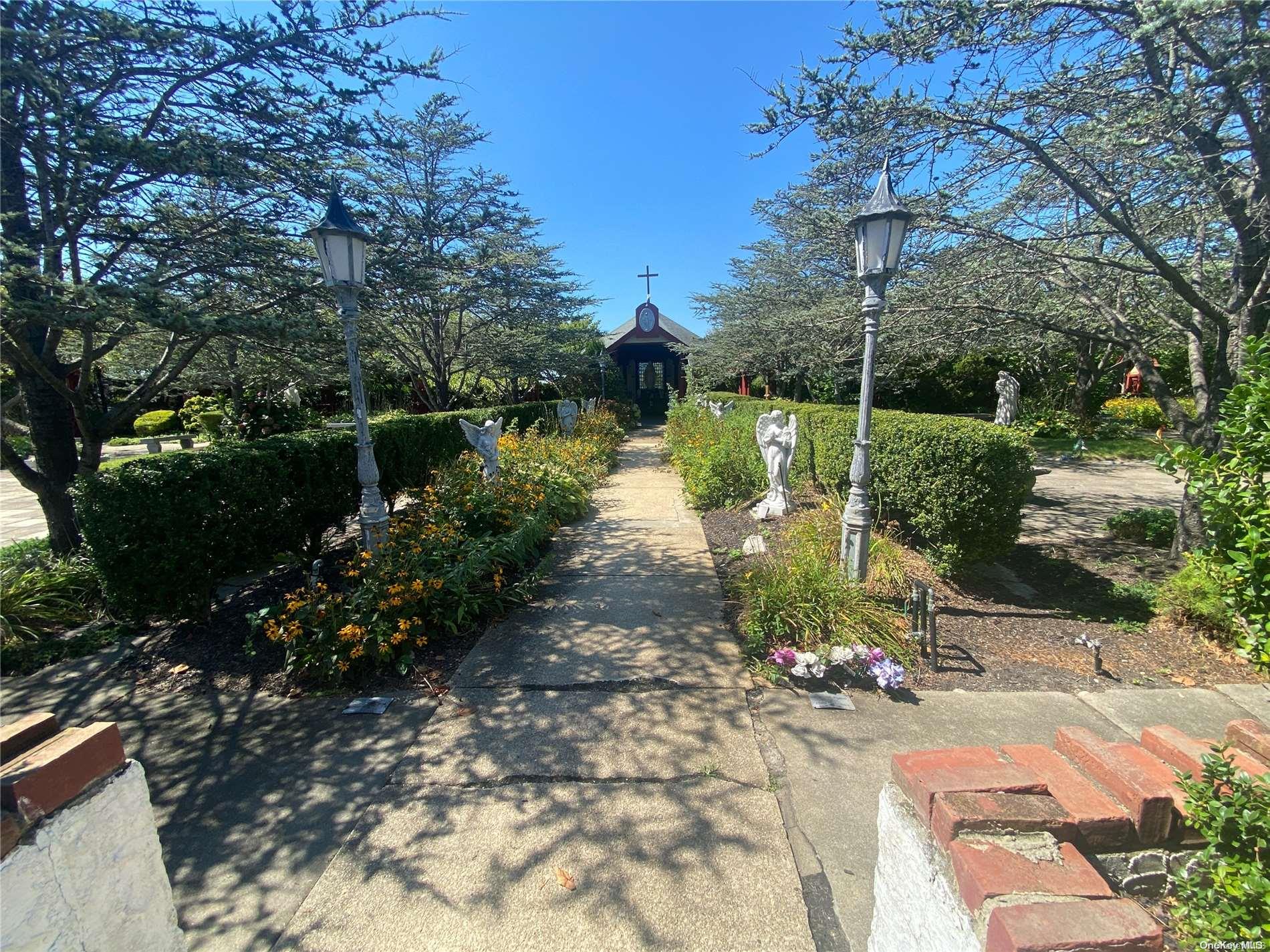 68 Parkside Drive Point Lookout, NY 11569 - Photo 13 of 17 a view of a lake with a yard