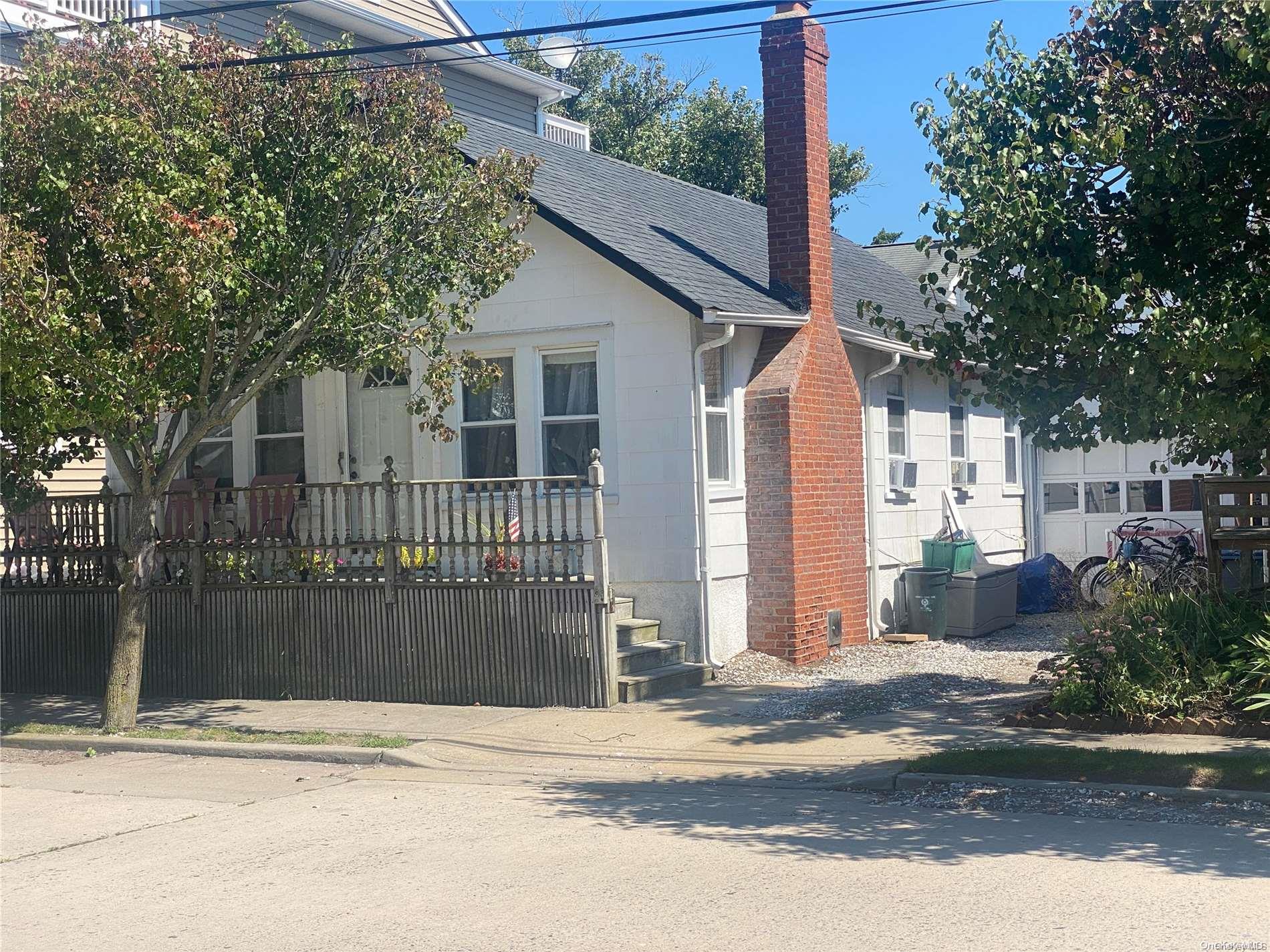 68 Parkside Drive Point Lookout, NY 11569 - Photo 14 of 17 a view of a house with a yard