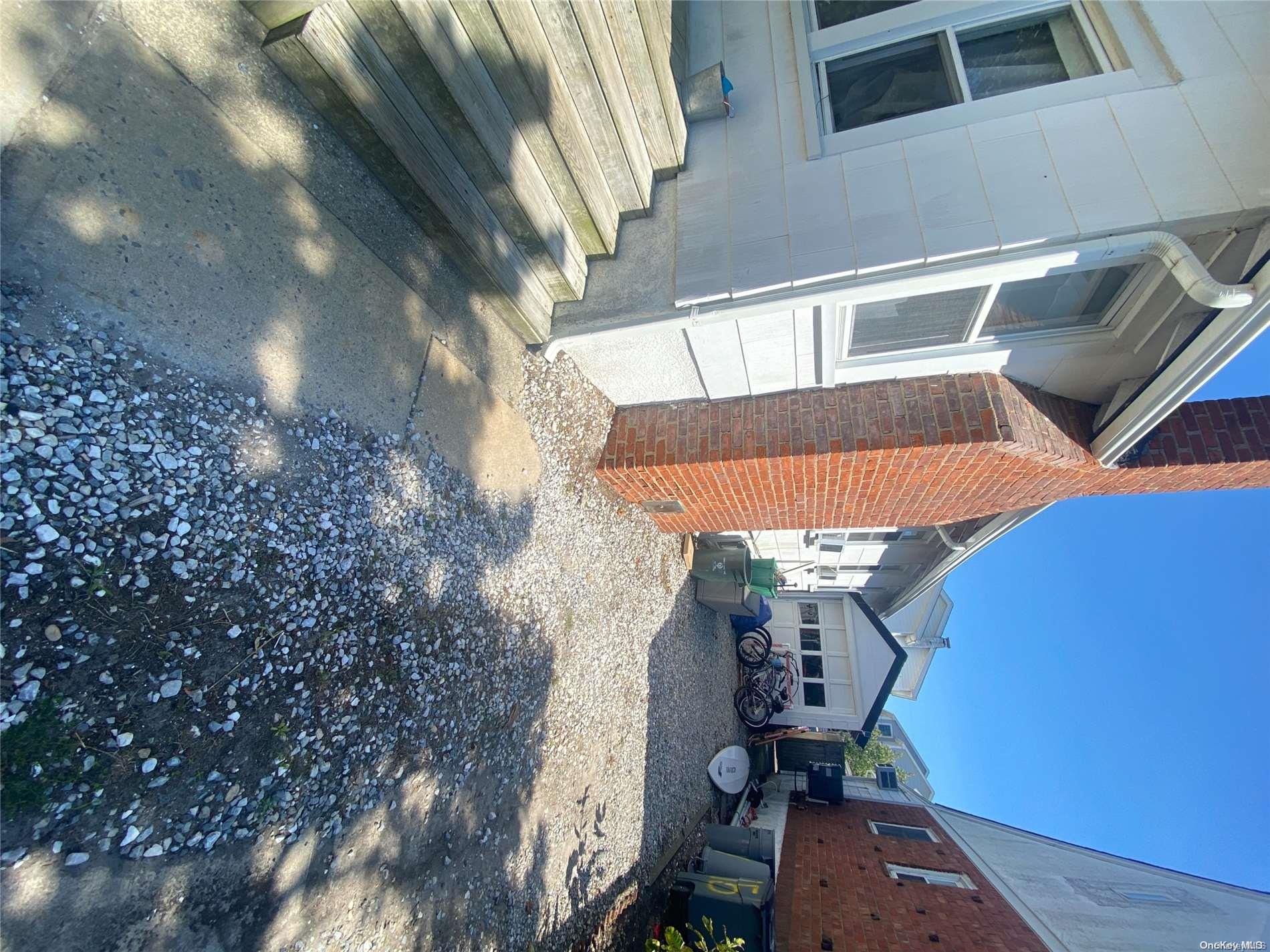 68 Parkside Drive Point Lookout, NY 11569 - Photo 10 of 17 a balcony with table and chairs