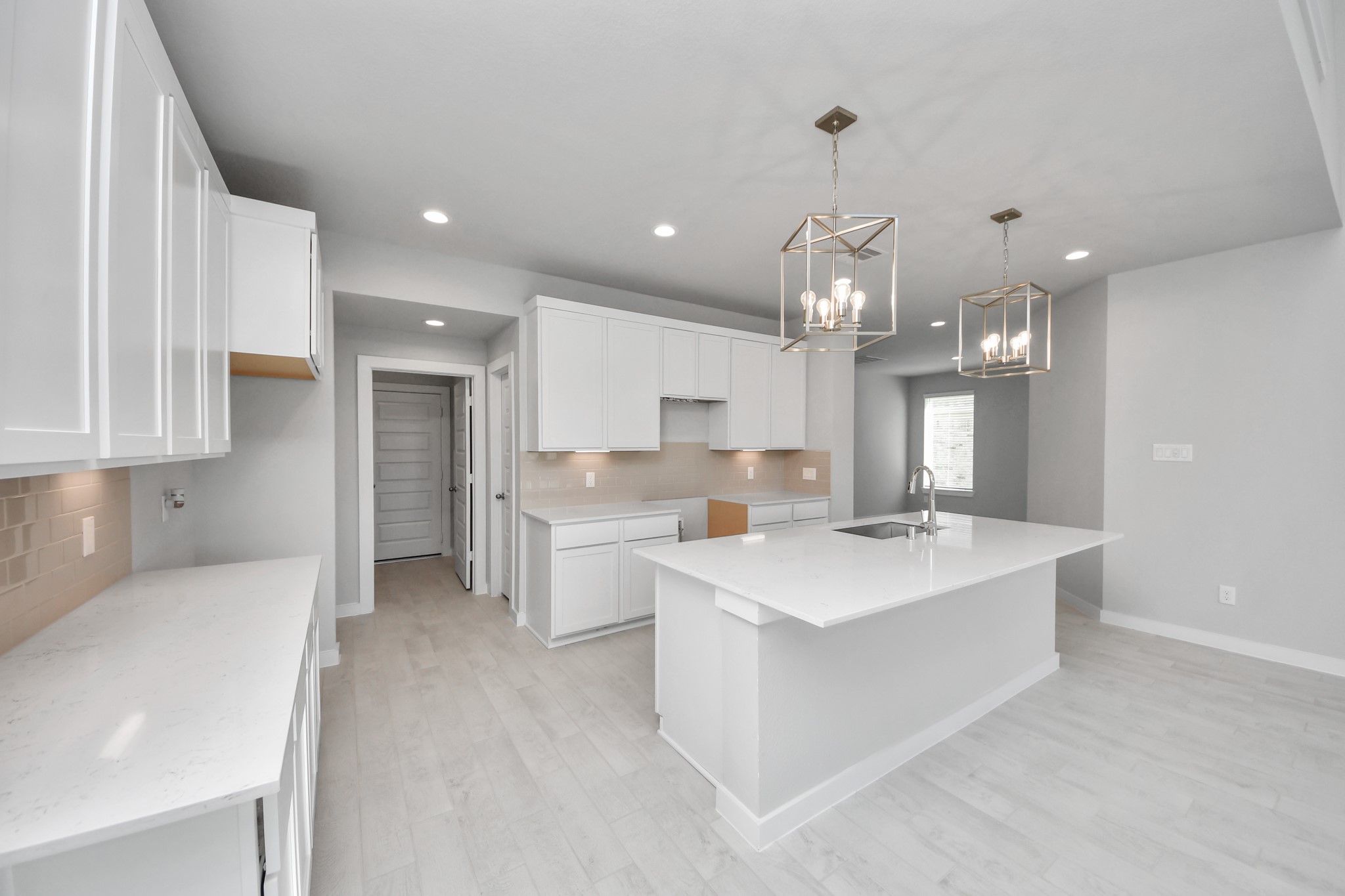 2926 Bury Park Dr Spring Spring, TX 77373 - Photo 13 of 38 All of this overlooks your expansive family room, creating a perfect space for culinary delights and family gatherings. Sample photo of completed home with similar floor plan. Actual colors and selections may vary.