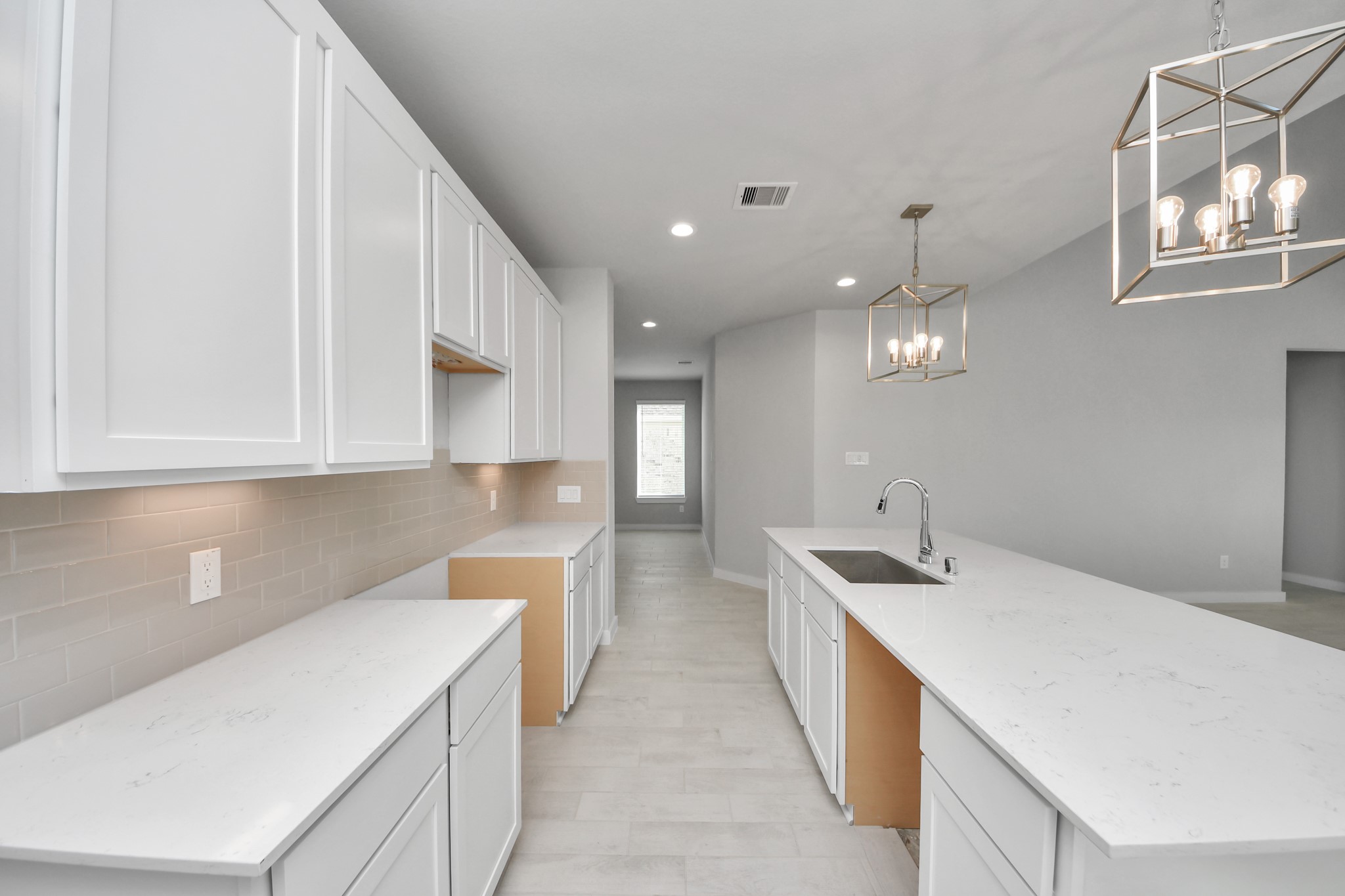 2926 Bury Park Dr Spring Spring, TX 77373 - Photo 14 of 38 The extended counter area adds both practicality and style, making meal preparation a breeze. Every detail is thoughtfully designed to enhance the kitchen's functionality and aesthetic appeal. Sample photo of completed home with similar floor plan. Actual colors and selections may vary.