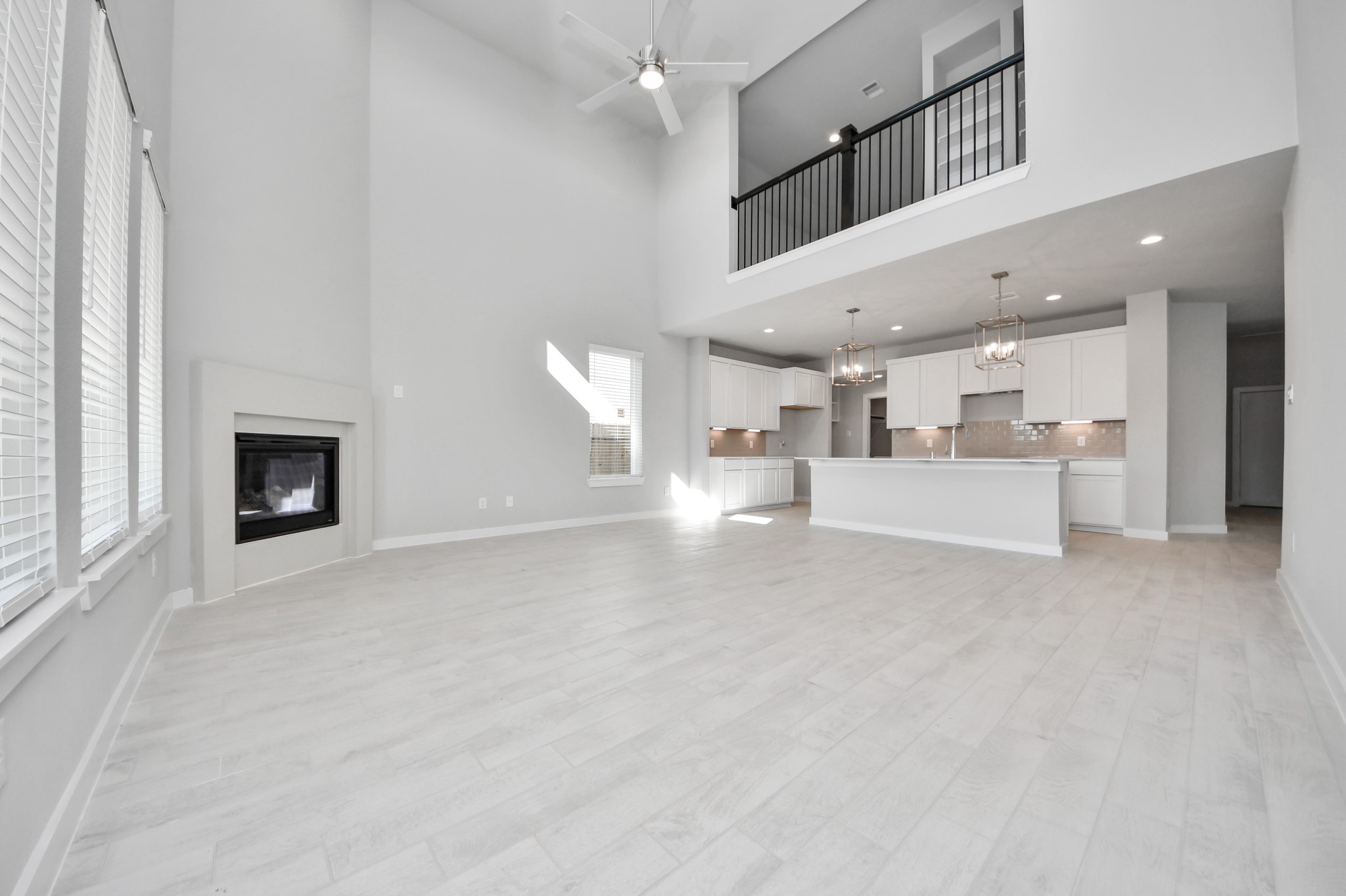 2926 Bury Park Dr Spring Spring, TX 77373 - Photo 20 of 38 Take another glimpse into the heart of the home with this additional view of the family room—a sprawling space ready to accommodate all your gatherings. Sample photo of completed home with similar floor plan. Actual colors and selections may vary.