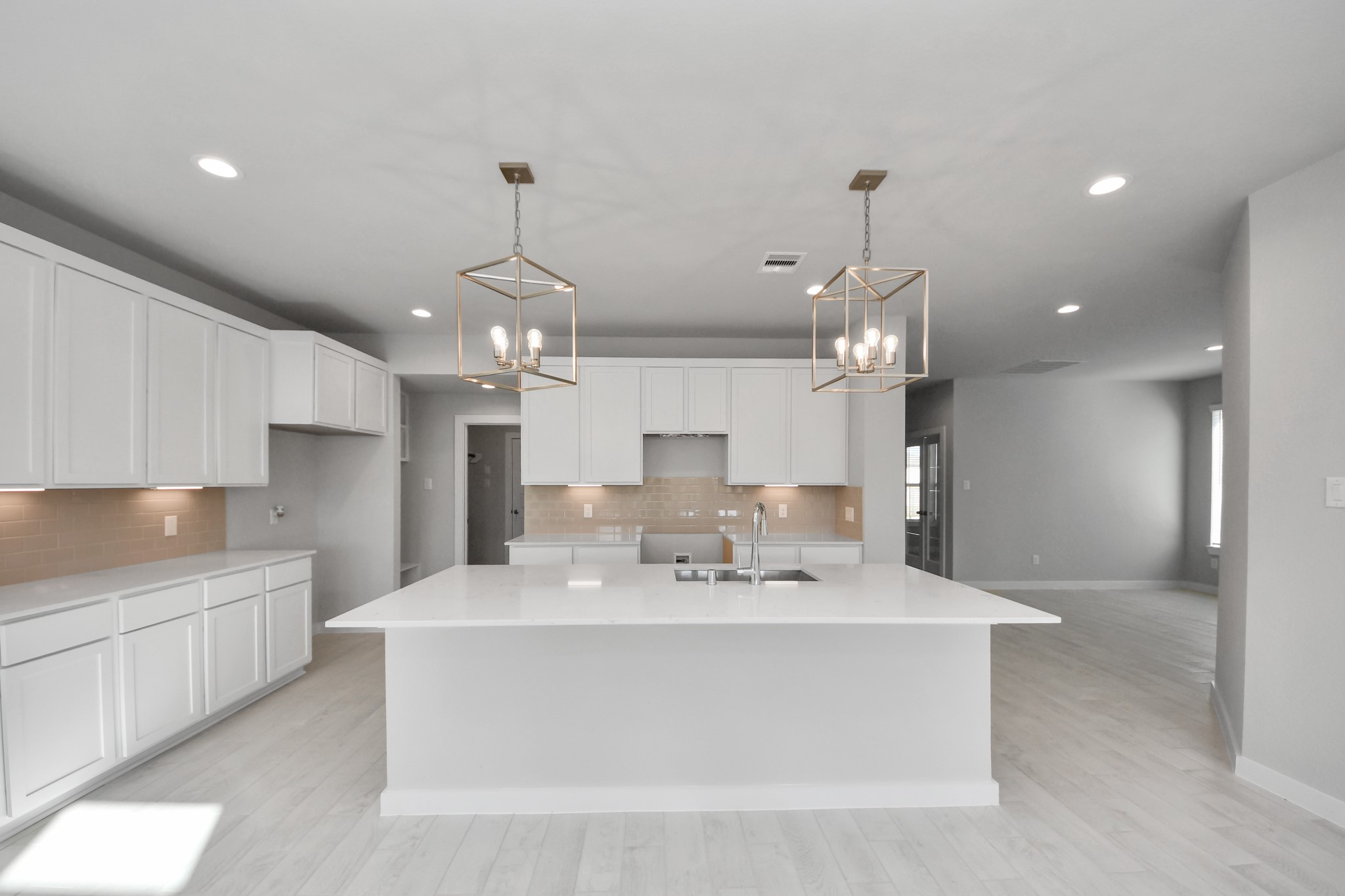 2926 Bury Park Dr Spring Spring, TX 77373 - Photo 9 of 38 This kitchen is by far any chef’s dream! This spacious kitchen features high ceilings, light stained wood cabinets, granite countertop, SS appliances, modern tile backsplash, recessed lighting, extended counter space, granite kitchen island with double sink, and space for breakfast bar, and a walk-in pantry all overlooking your huge family room. Sample photo of completed home with similar floor plan. Actual colors and selections may vary.