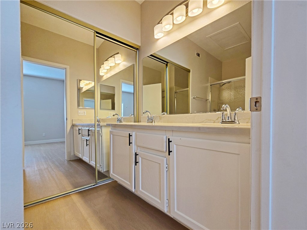 5370 Runningbrook Road Las Vegas, NV 89120 - Photo 21 of 30 Double vanity with spacious countertops and ample storage enhance this well-appointed bathroom.
