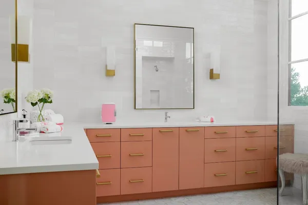 a bedroom with two beds and a large window