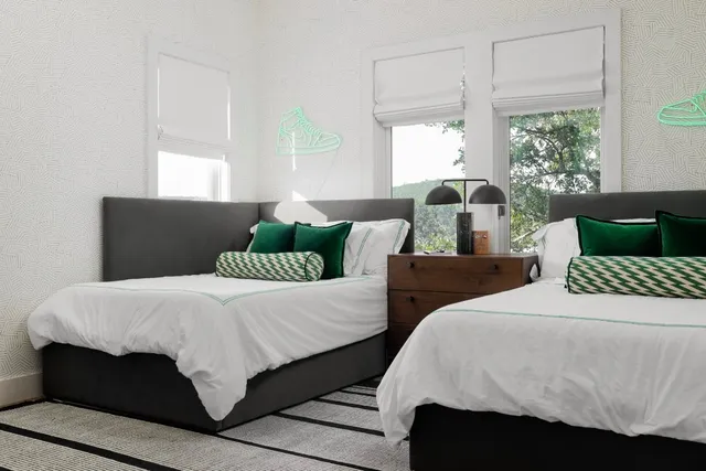 a bedroom with a bed and a night stand