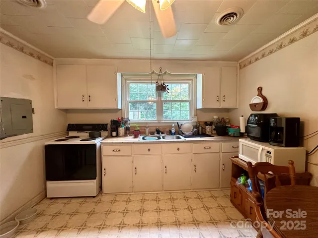 a kitchen with a cabinets and window