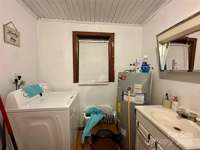 a bathroom with a sink toilet and a mirror