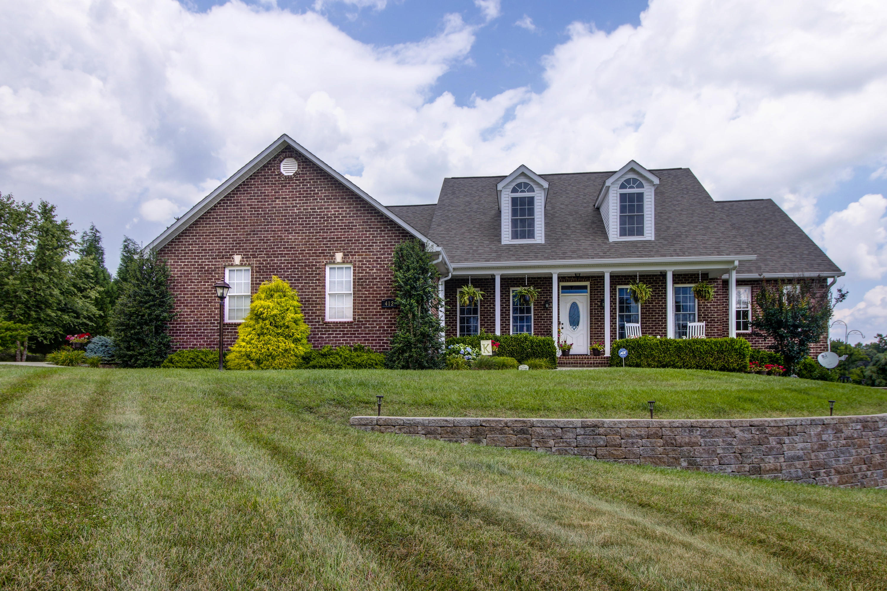 412 Thornblade Way Blue Ridge, VA 24064 - Photo 2 of 47 a front view of a house with a yard and garage