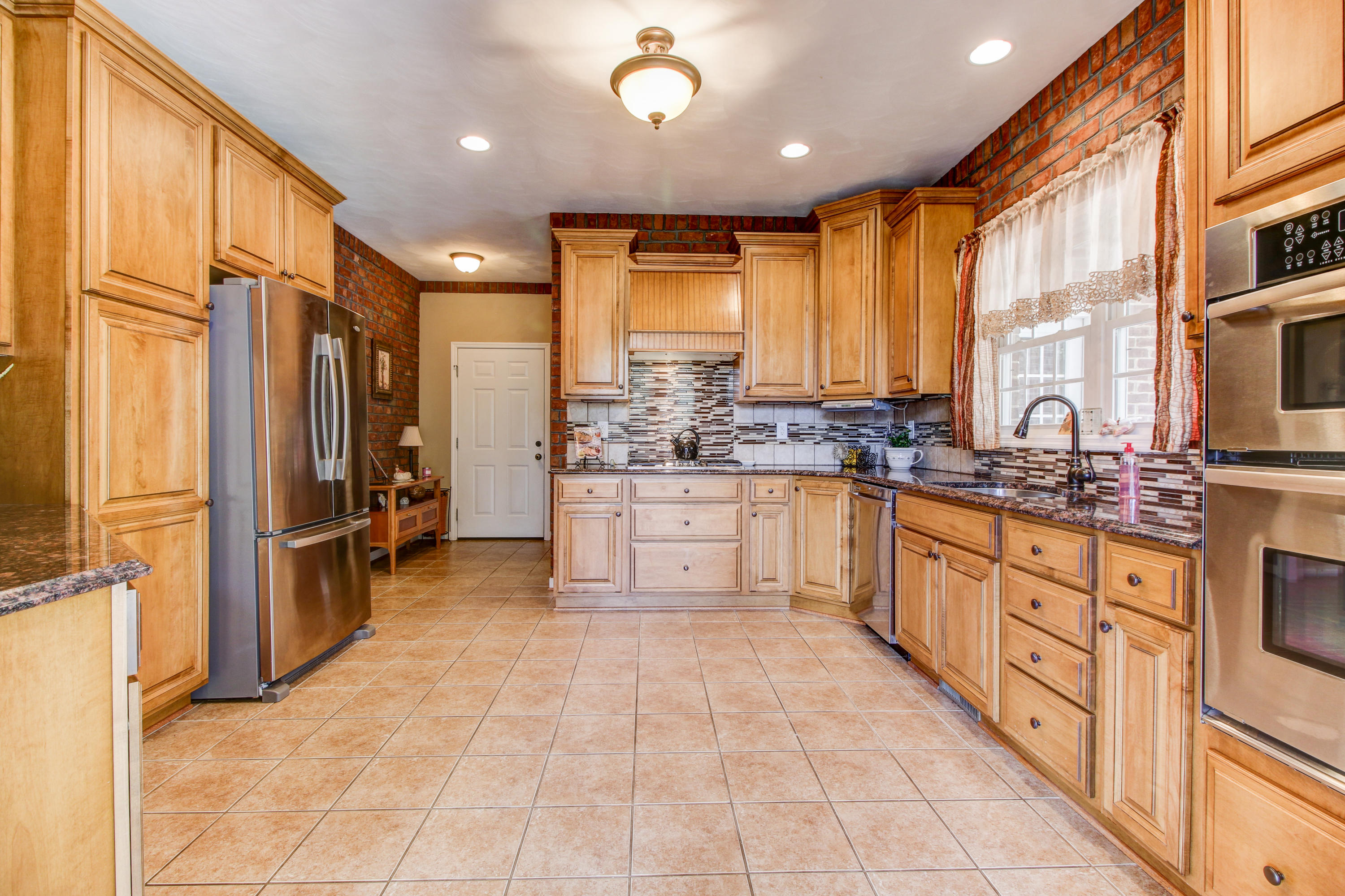 412 Thornblade Way Blue Ridge, VA 24064 - Photo 11 of 47 a large kitchen with stainless steel appliances lots of counter top space