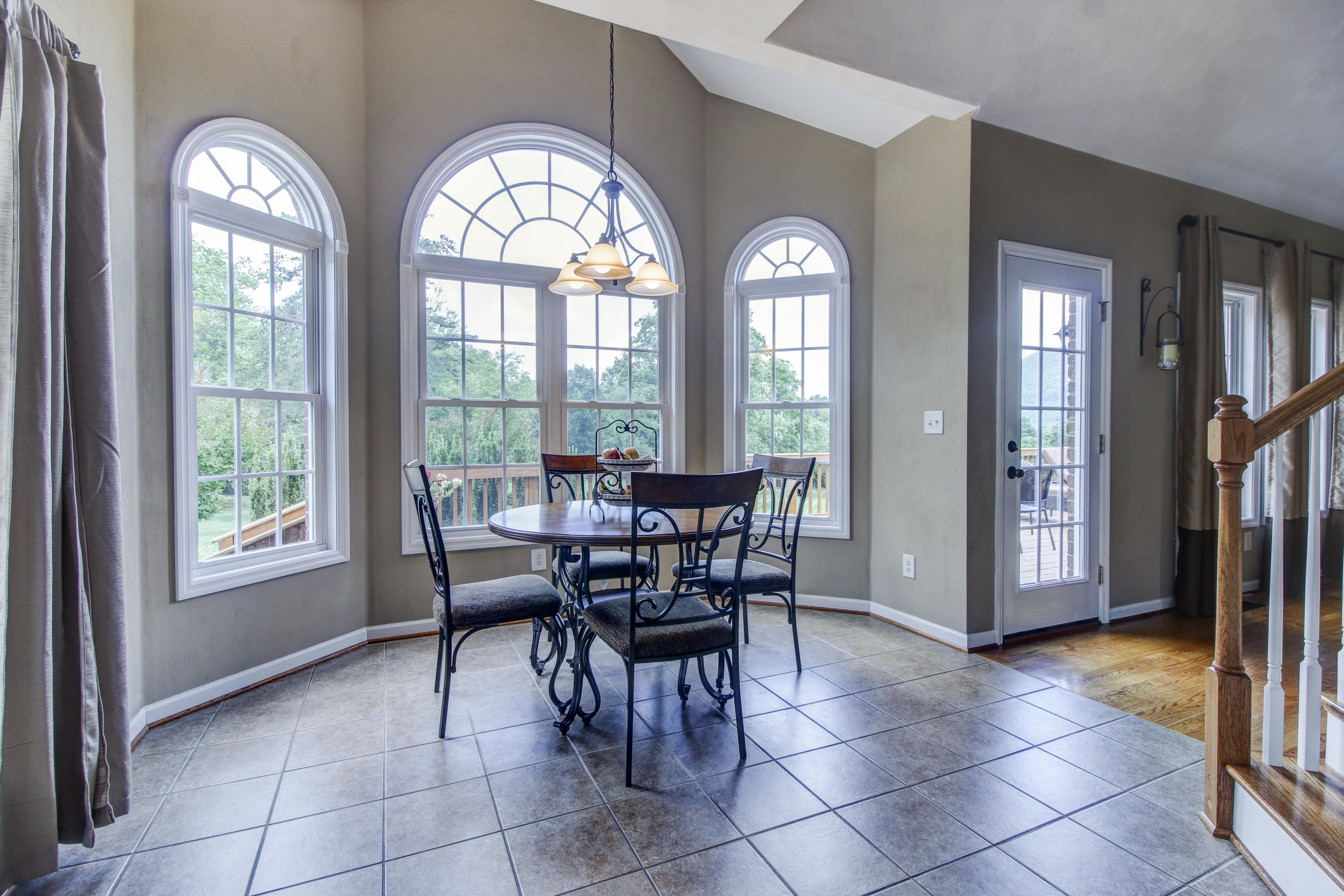 412 Thornblade Way Blue Ridge, VA 24064 - Photo 14 of 47 a view of a livingroom with furniture and a floor to ceiling window
