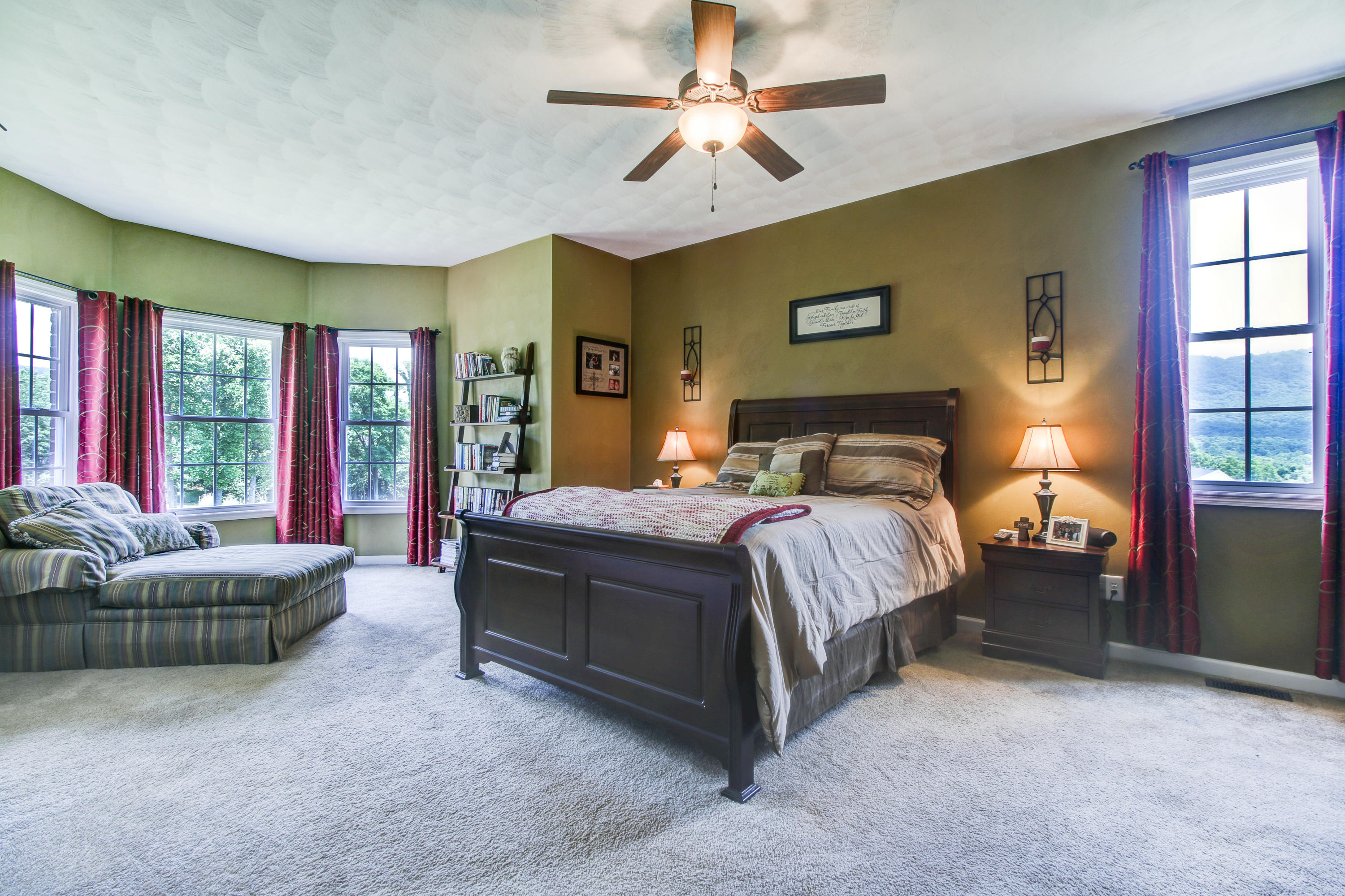 412 Thornblade Way Blue Ridge, VA 24064 - Photo 17 of 47 a bedroom with a large bed couch and a window