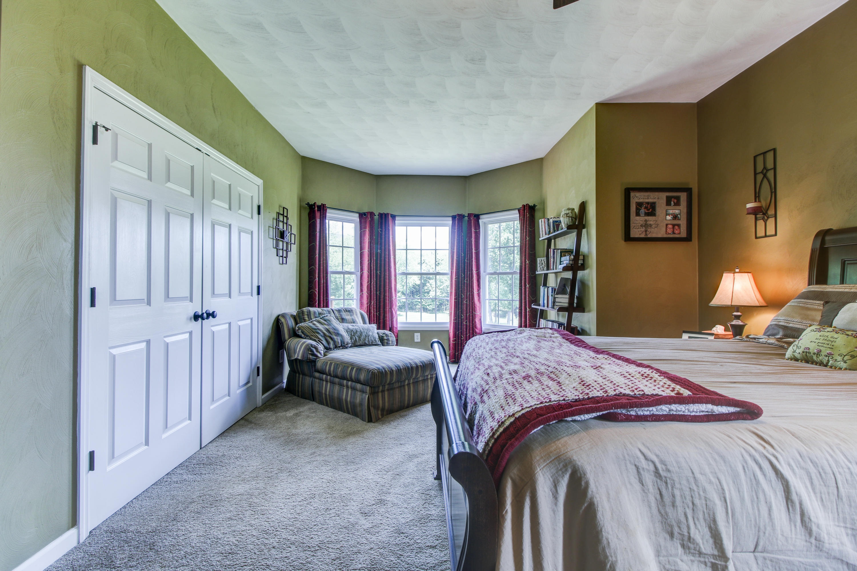 412 Thornblade Way Blue Ridge, VA 24064 - Photo 18 of 47 a bedroom with a bed and a couch