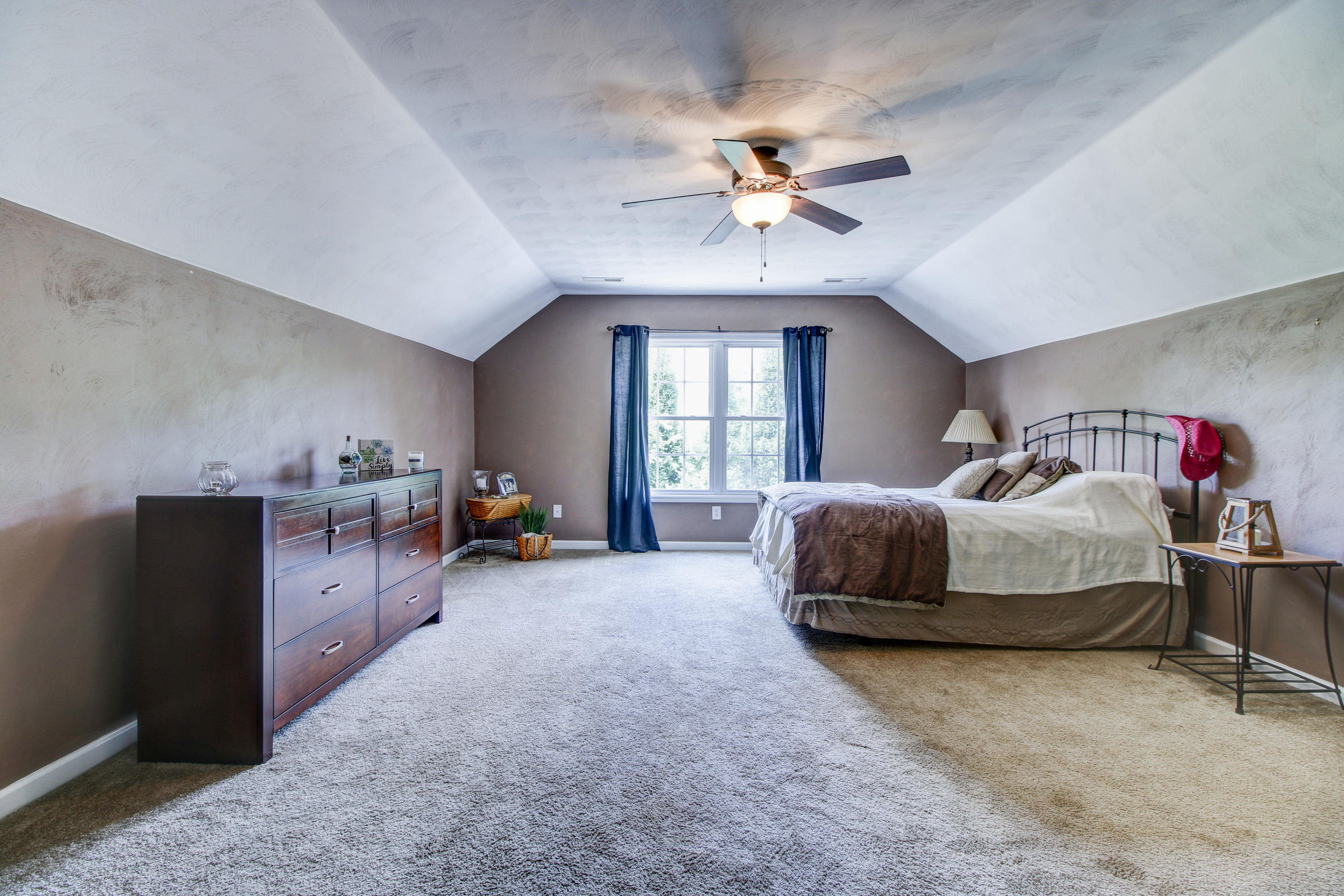 412 Thornblade Way Blue Ridge, VA 24064 - Photo 20 of 47 a bedroom with a bed and ceiling fan