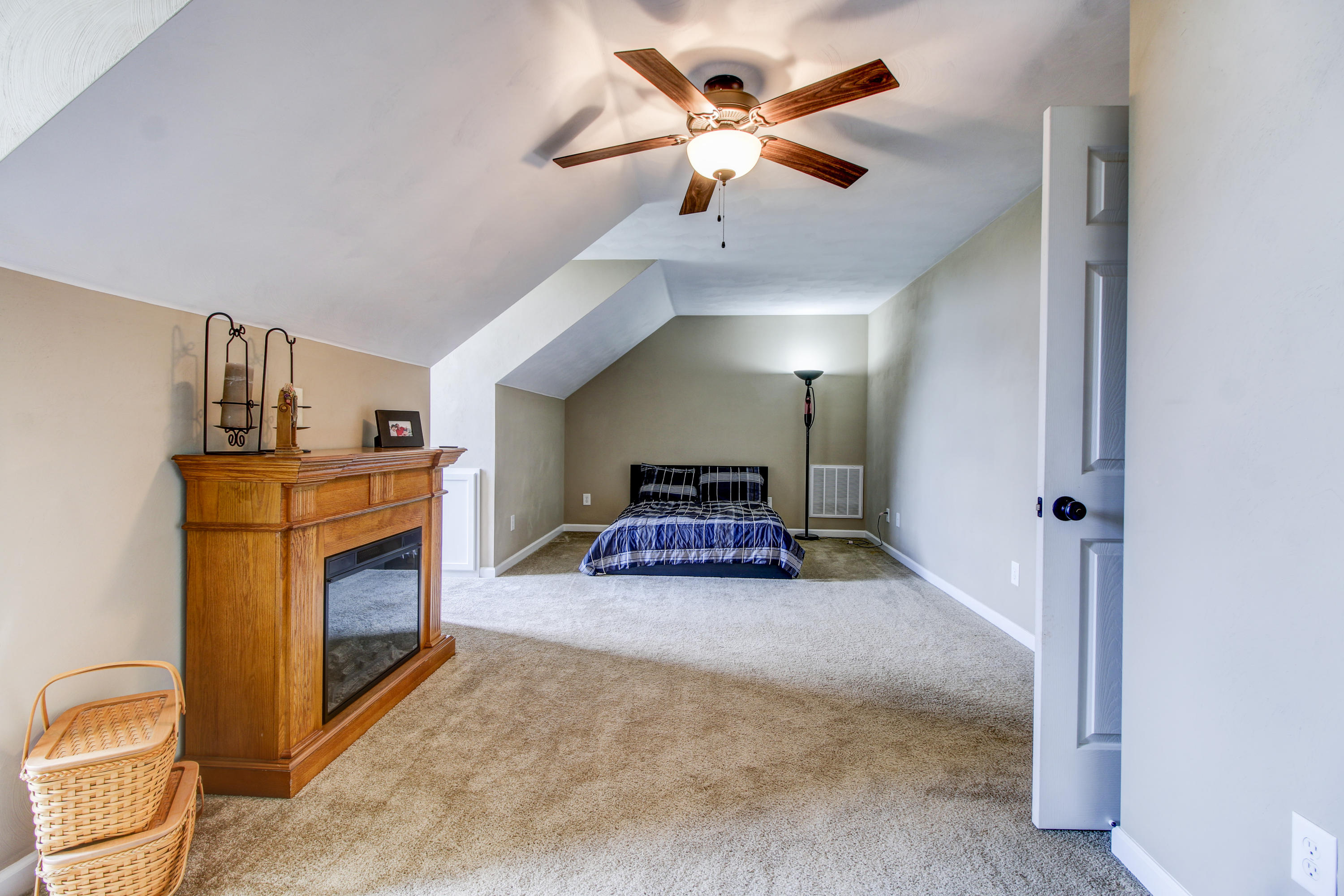 412 Thornblade Way Blue Ridge, VA 24064 - Photo 21 of 47 a living room with furniture a fireplace and a ceiling fan