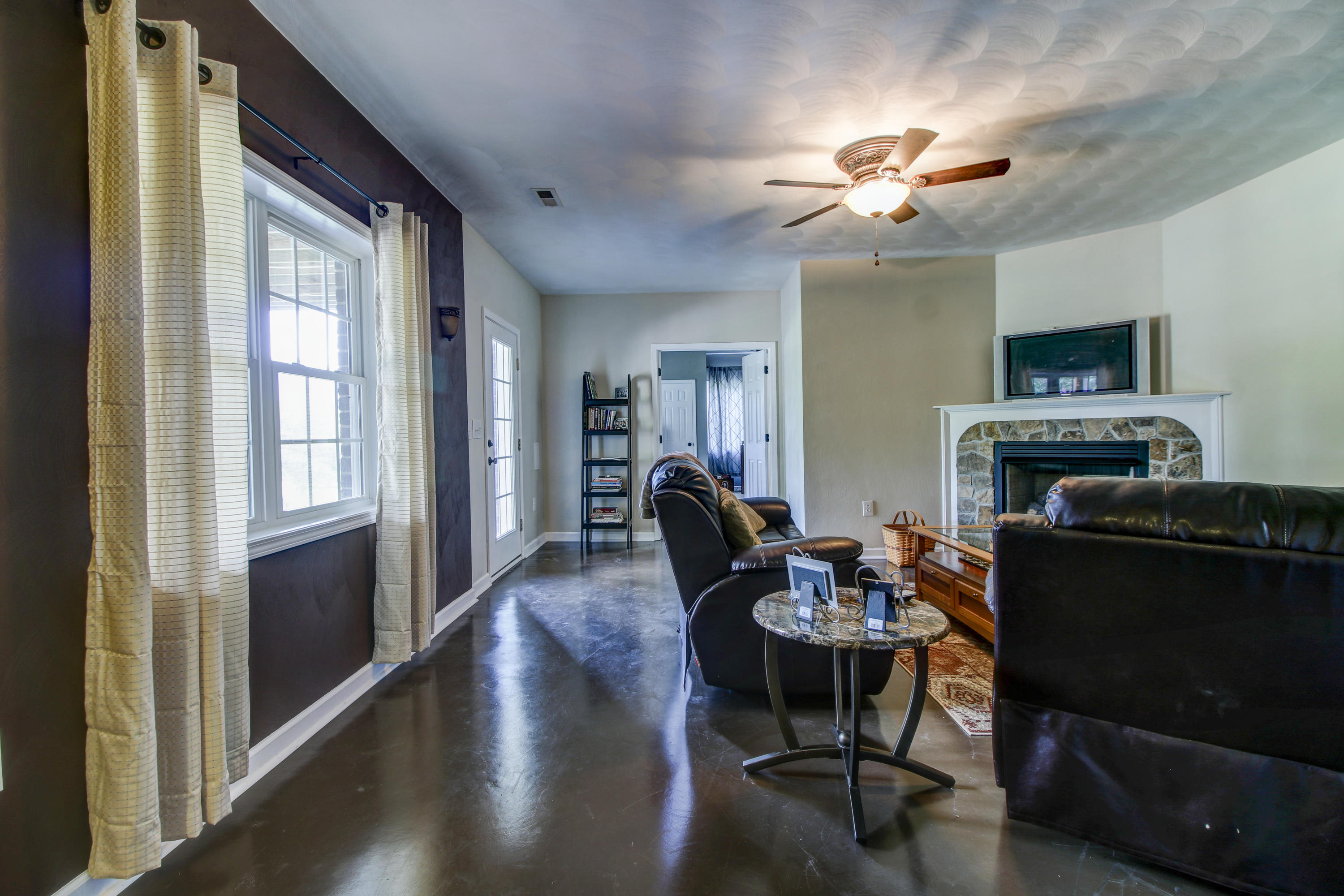 412 Thornblade Way Blue Ridge, VA 24064 - Photo 29 of 47 a dining room with furniture a chandelier fan and wooden floor