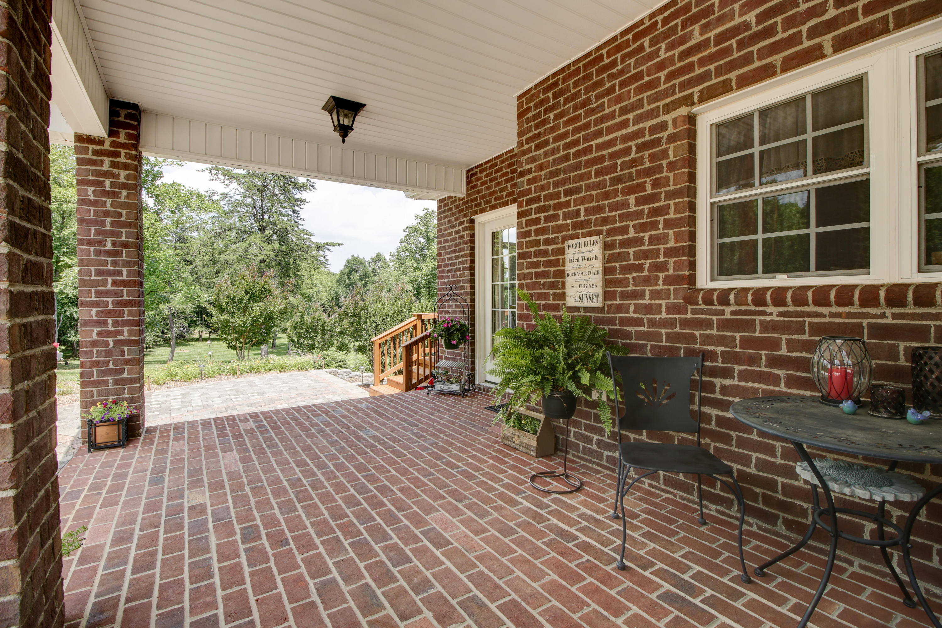 412 Thornblade Way Blue Ridge, VA 24064 - Photo 32 of 47 a view of a porch with a bench