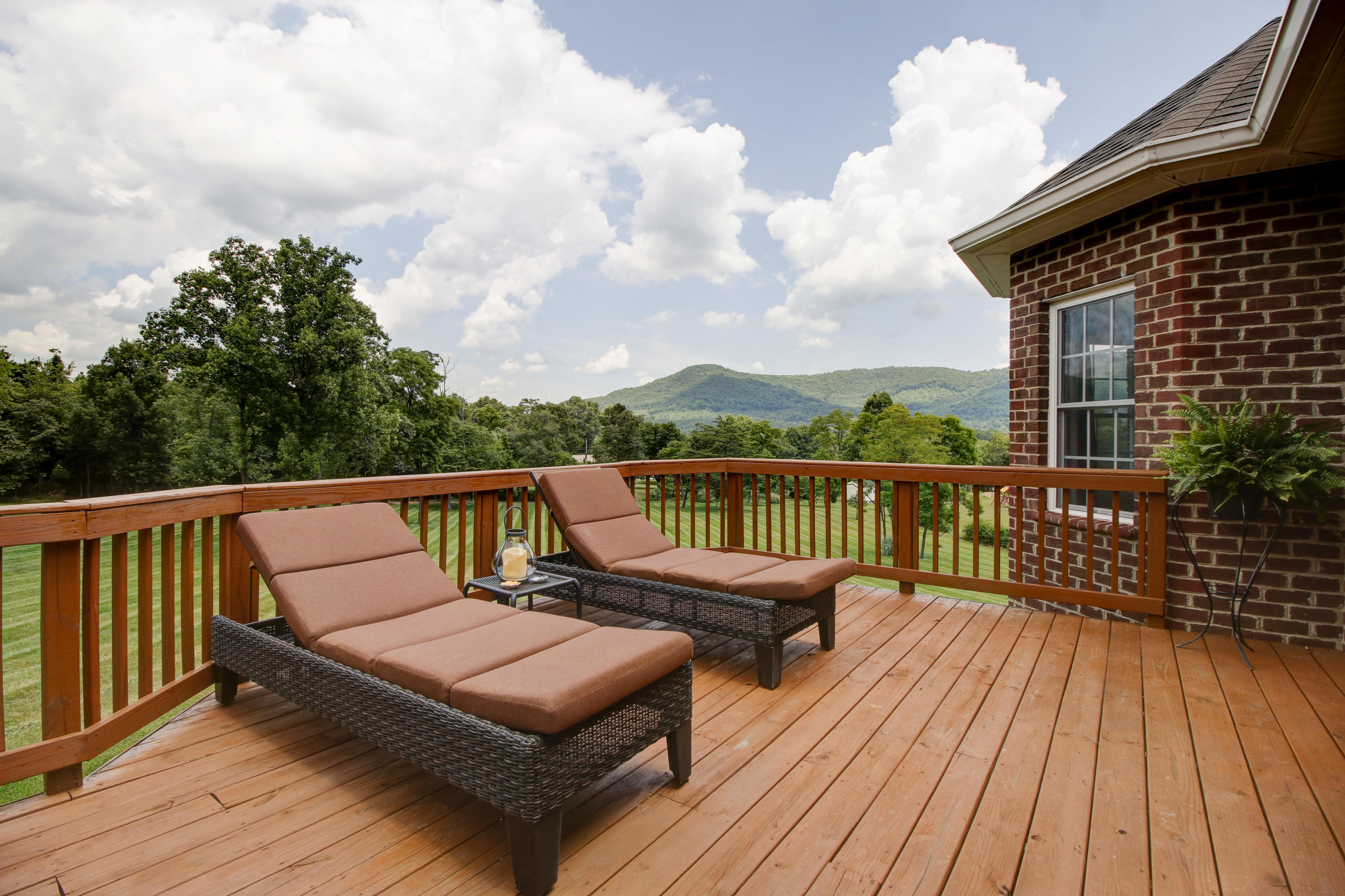412 Thornblade Way Blue Ridge, VA 24064 - Photo 41 of 47 a balcony with wooden floor table and chairs