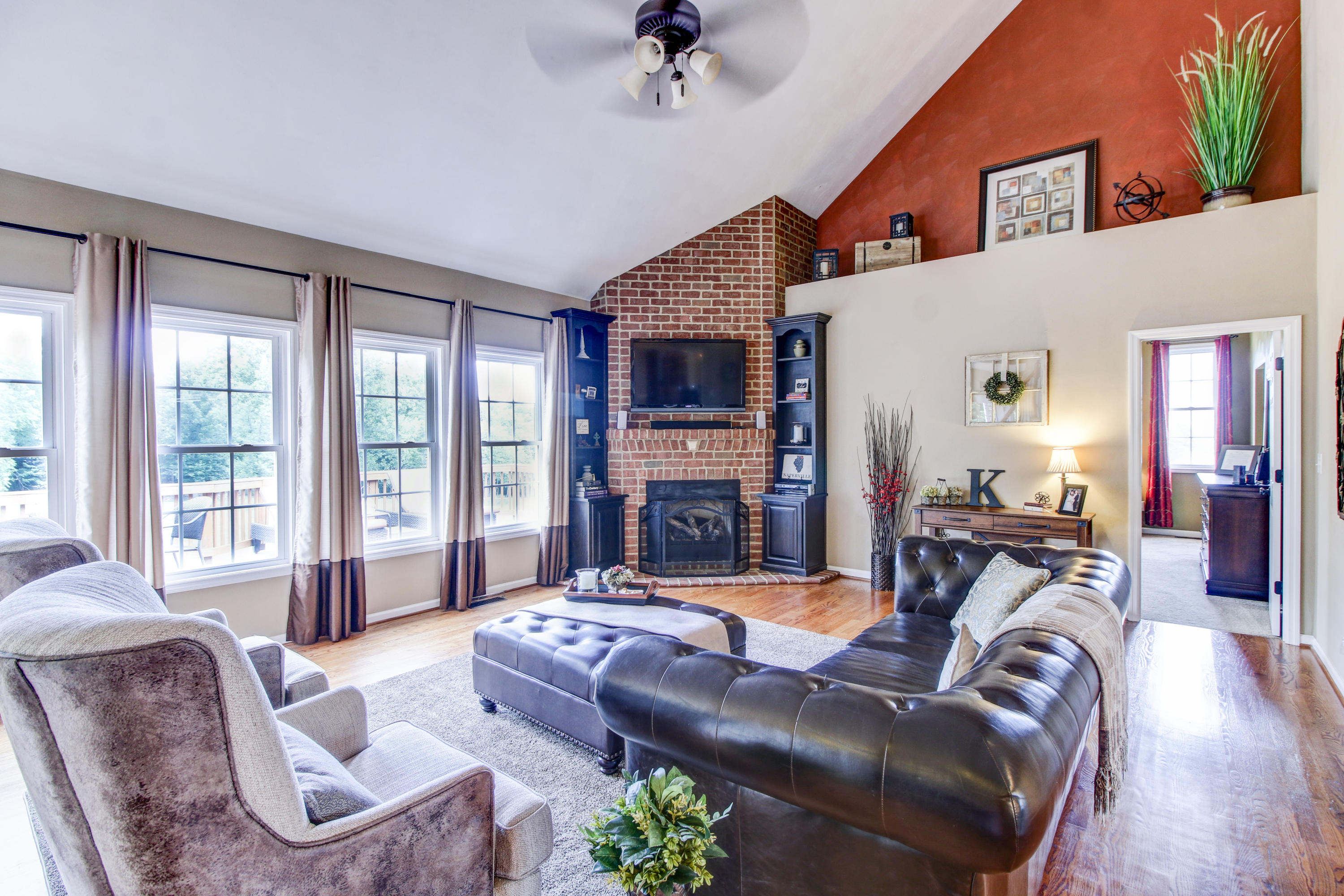 412 Thornblade Way Blue Ridge, VA 24064 - Photo 8 of 47 a living room with furniture large window and a fireplace