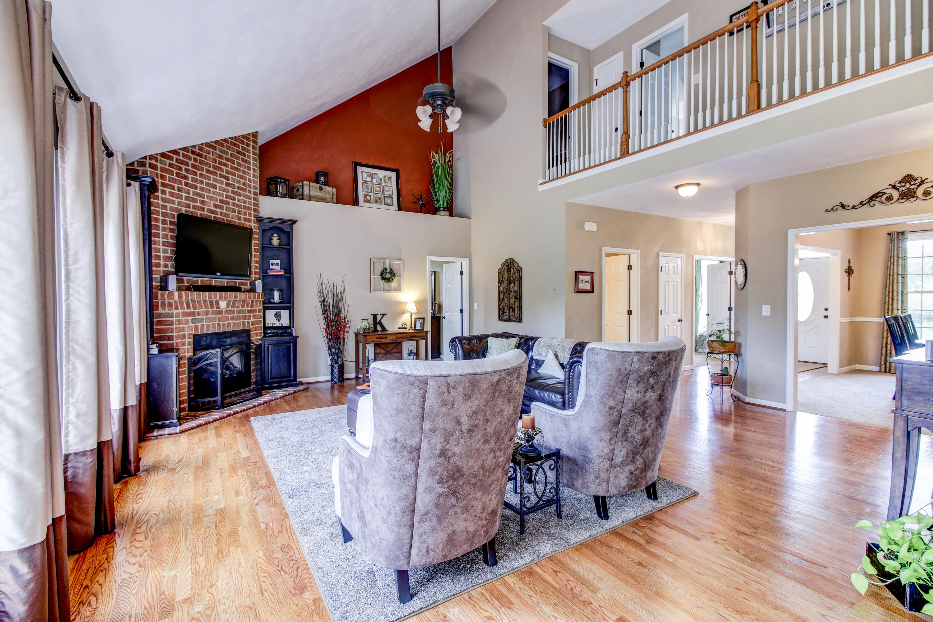 412 Thornblade Way Blue Ridge, VA 24064 - Photo 10 of 47 a living room with furniture and a wooden floor