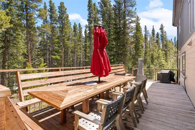 a view of a patio with a table and chairs