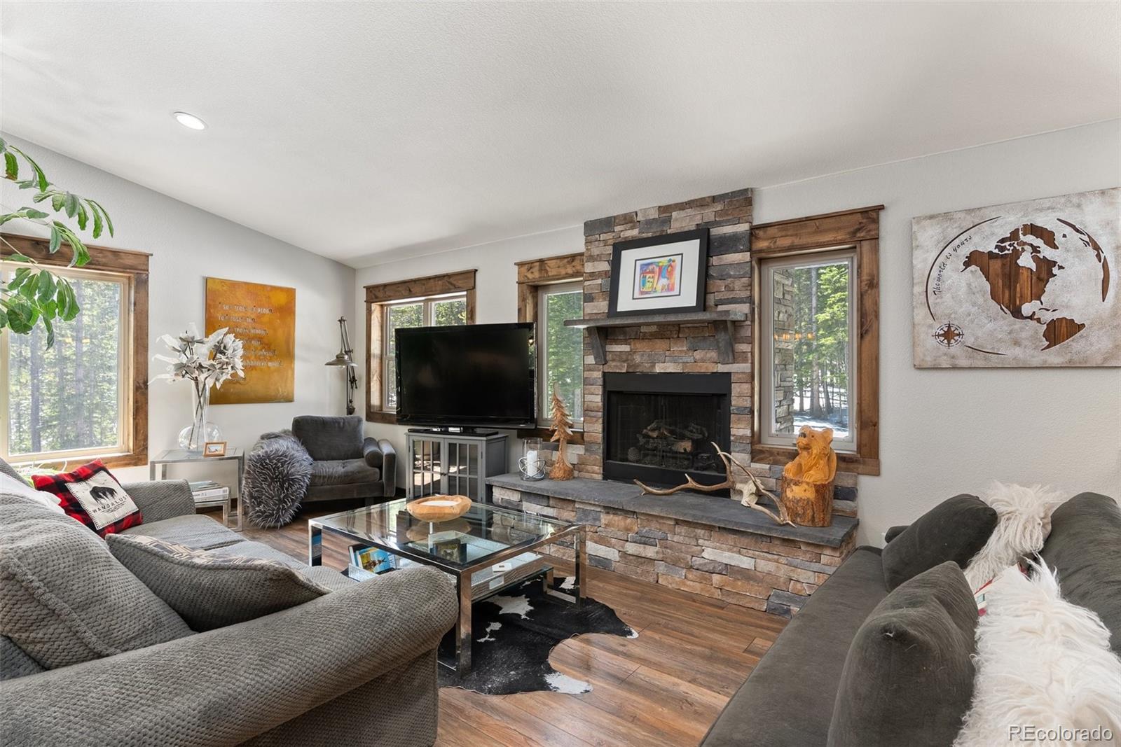 400 Upper Forest Road Idaho Springs, CO 80452 - Photo 4 of 20 a living room with furniture and a flat screen tv