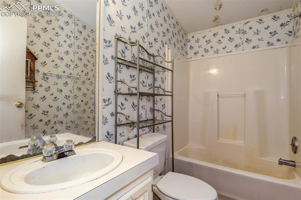 36210 Heavenly View Yoder, CO 80864 - Photo 18 of 42 a bathroom with a sink toilet and shower