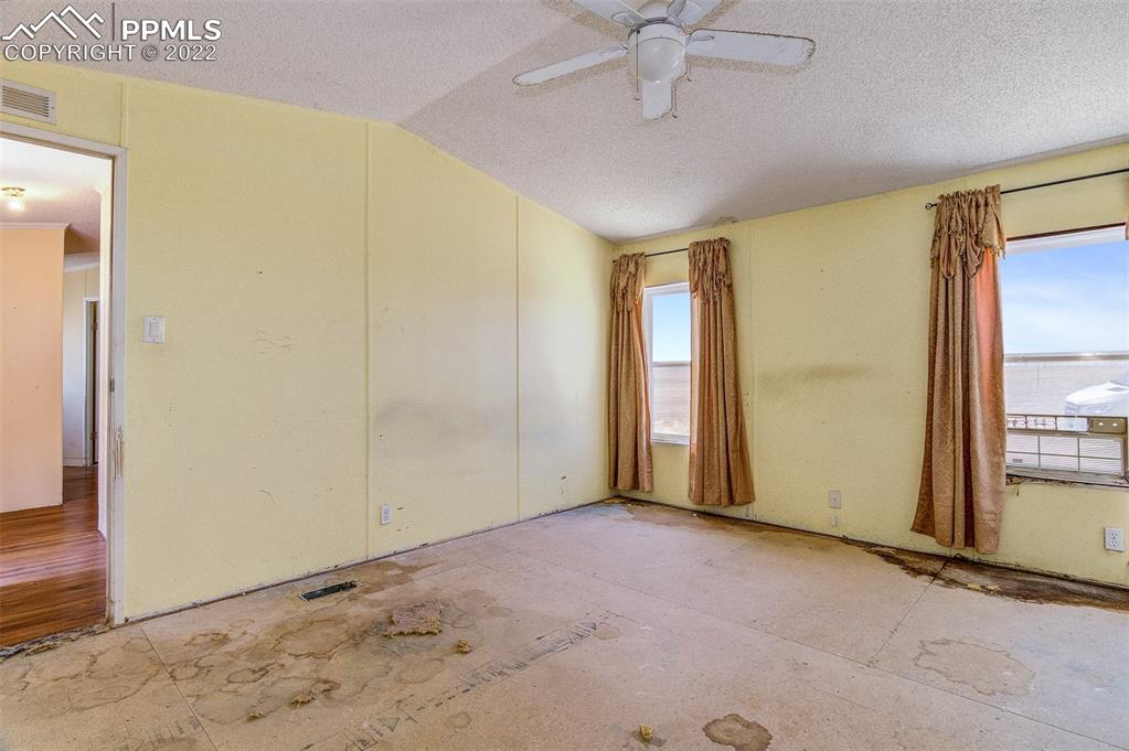 36210 Heavenly View Yoder, CO 80864 - Photo 23 of 42 an empty room with a empty space and windows