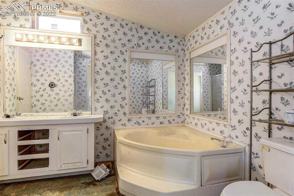36210 Heavenly View Yoder, CO 80864 - Photo 25 of 42 a bathroom with a sink and a mirror