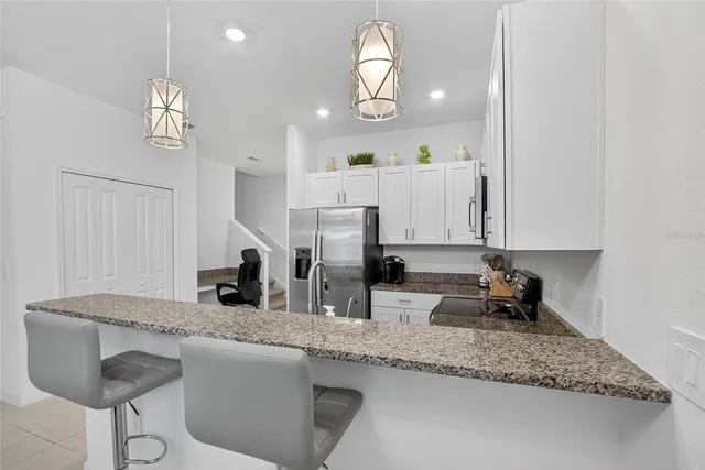 a bedroom with a large bed and a flat screen tv