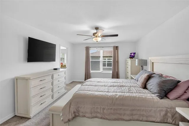 an aerial view of a house with a ocean