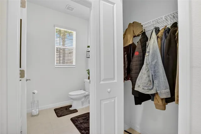 a kitchen with granite countertop a sink a counter top space and cabinets