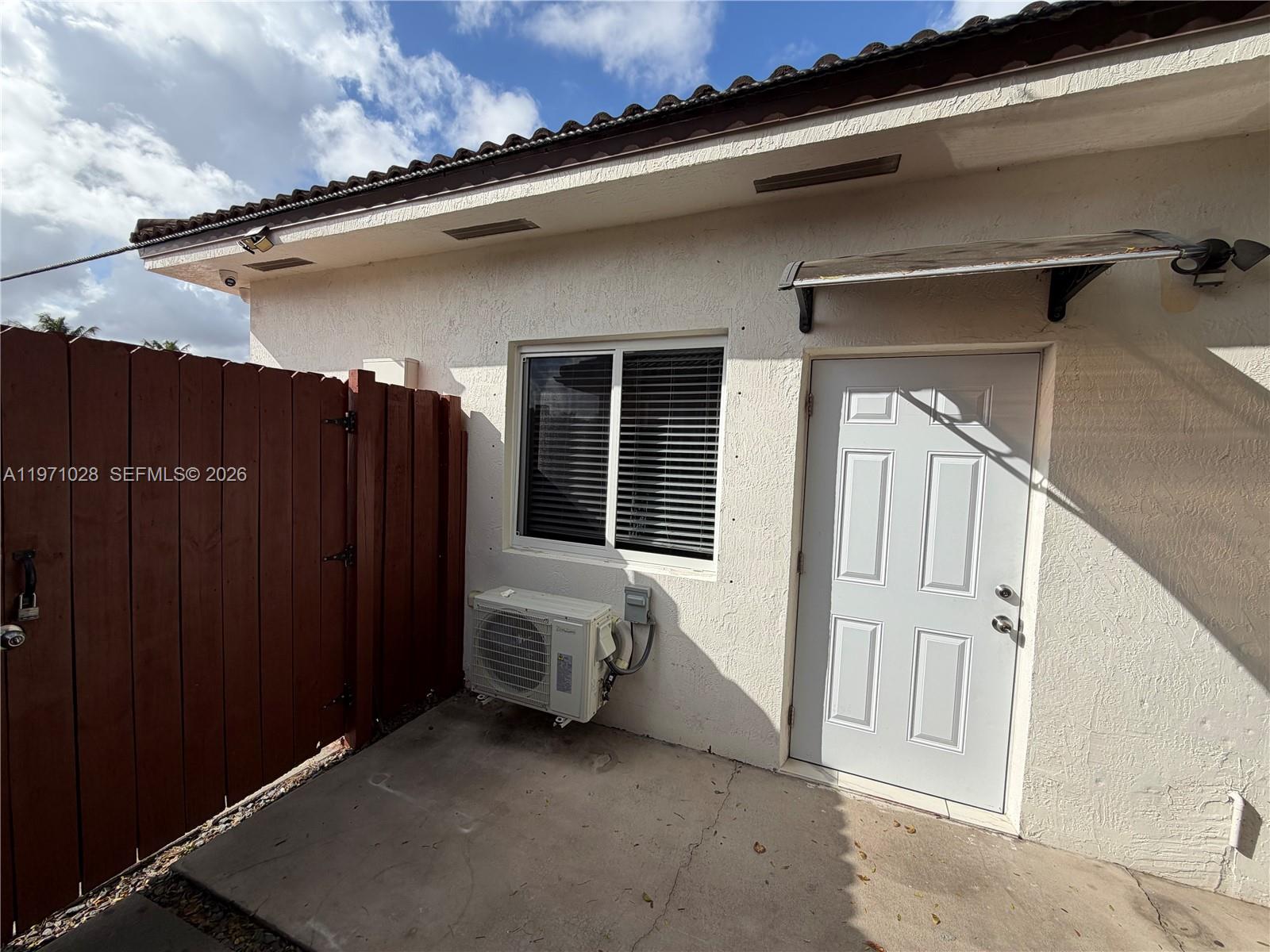 18255 Southwest 145th Avenue, Unit BACK Miami, FL 33177 - Photo 4 of 15 view of the house with a street