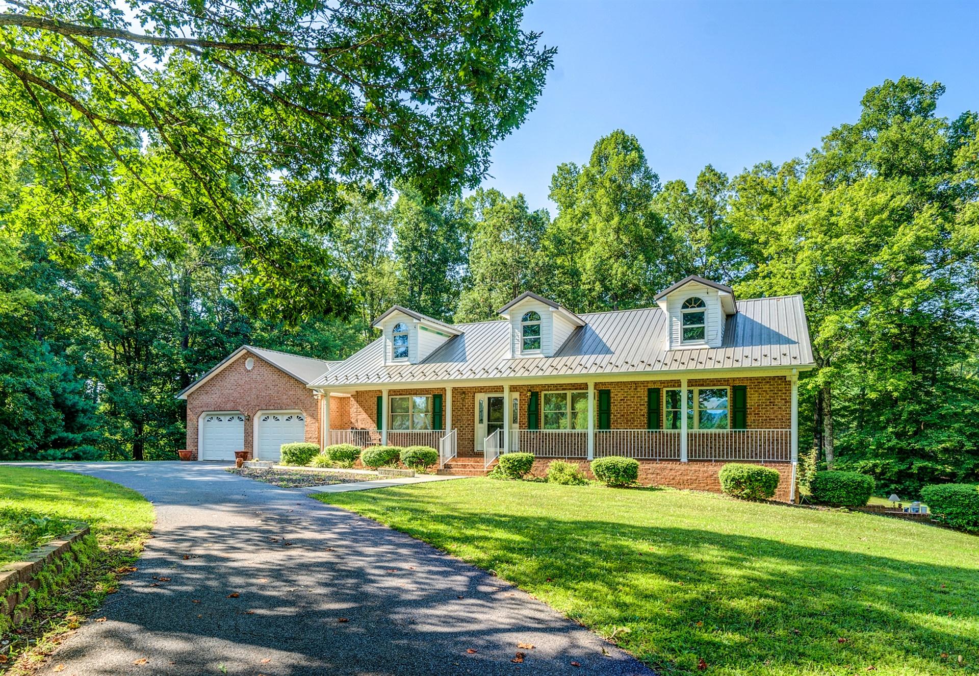414 Thompson Ridge Circle Ferrum, VA 24088 - Photo 3 of 33 a front view of a house with yard patio and green space