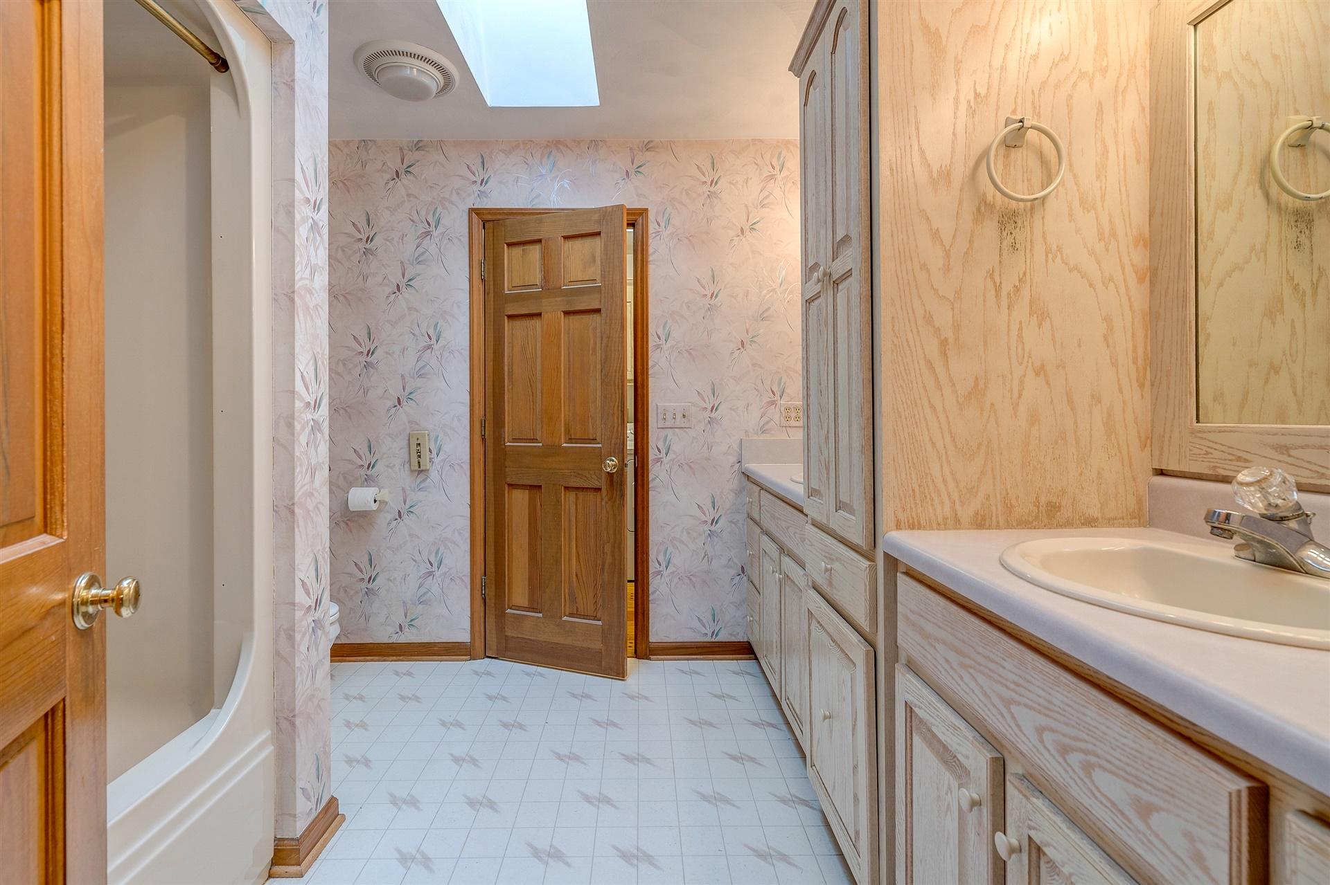 414 Thompson Ridge Circle Ferrum, VA 24088 - Photo 23 of 33 a bathroom with a sink and a mirror