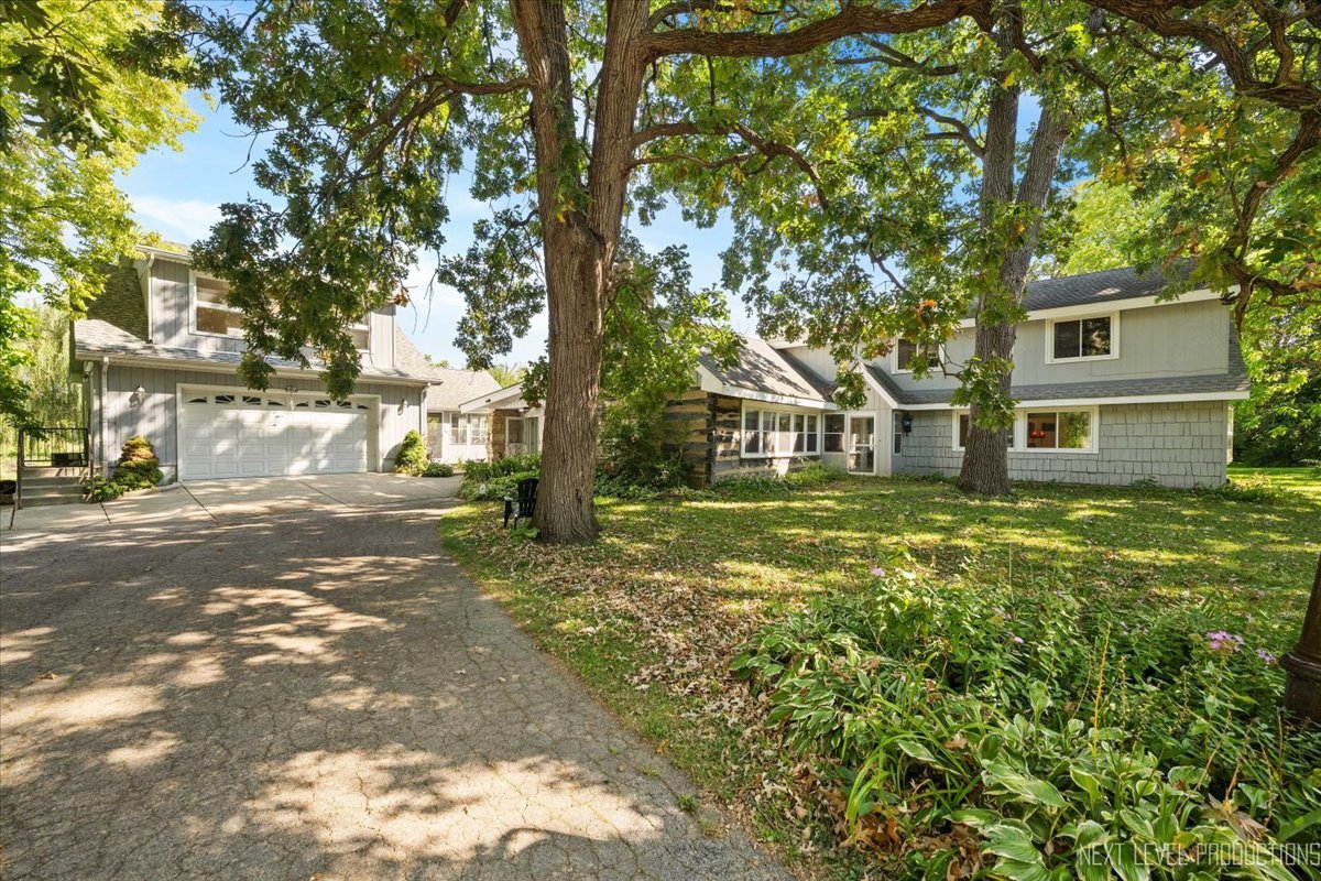 7N384 Whispering Willows Street St. Charles, IL 60174 - Photo 1 of 48 a view of road with large trees