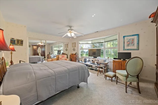 a bedroom with bed and window