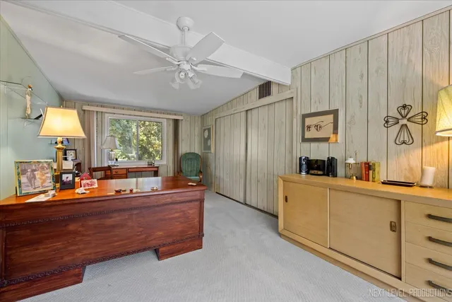 a room with a bed and a chandelier