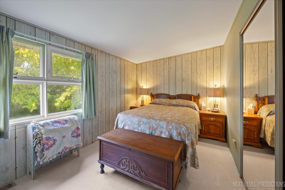 7N384 Whispering Willows Street St. Charles, IL 60174 - Photo 23 of 48 a bedroom with a bed and a window