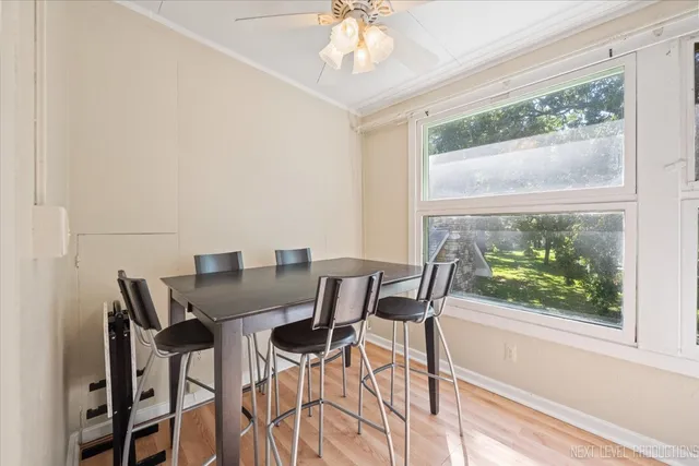 a view of a dining room with furniture window and outside view