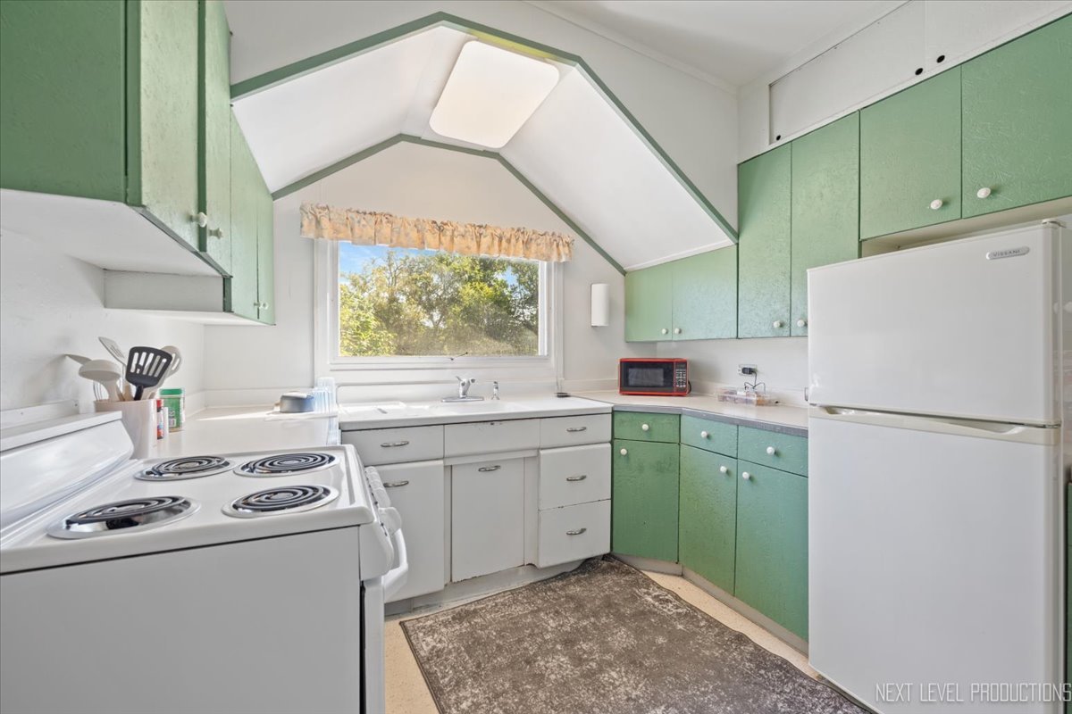 7N384 Whispering Willows Street St. Charles, IL 60174 - Photo 31 of 48 a kitchen with a refrigerator sink and cabinets