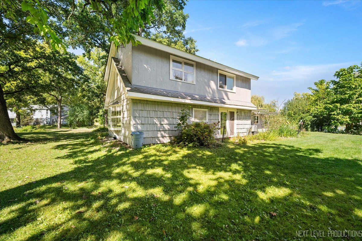 7N384 Whispering Willows Street St. Charles, IL 60174 - Photo 38 of 48 a view of a house with a yard