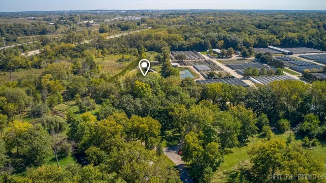an aerial view of residential house with outdoor space