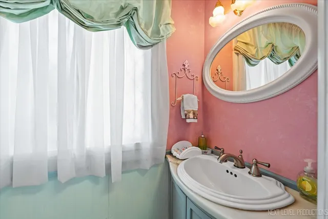 a bathroom with a sink and a mirror