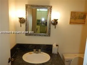 a bathroom with a sink and mirror