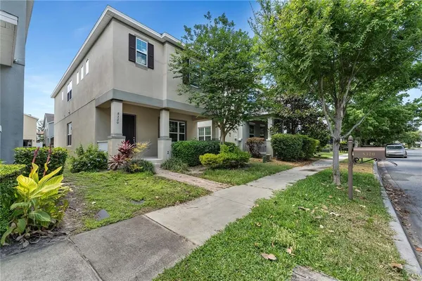 a front view of a house with a yard