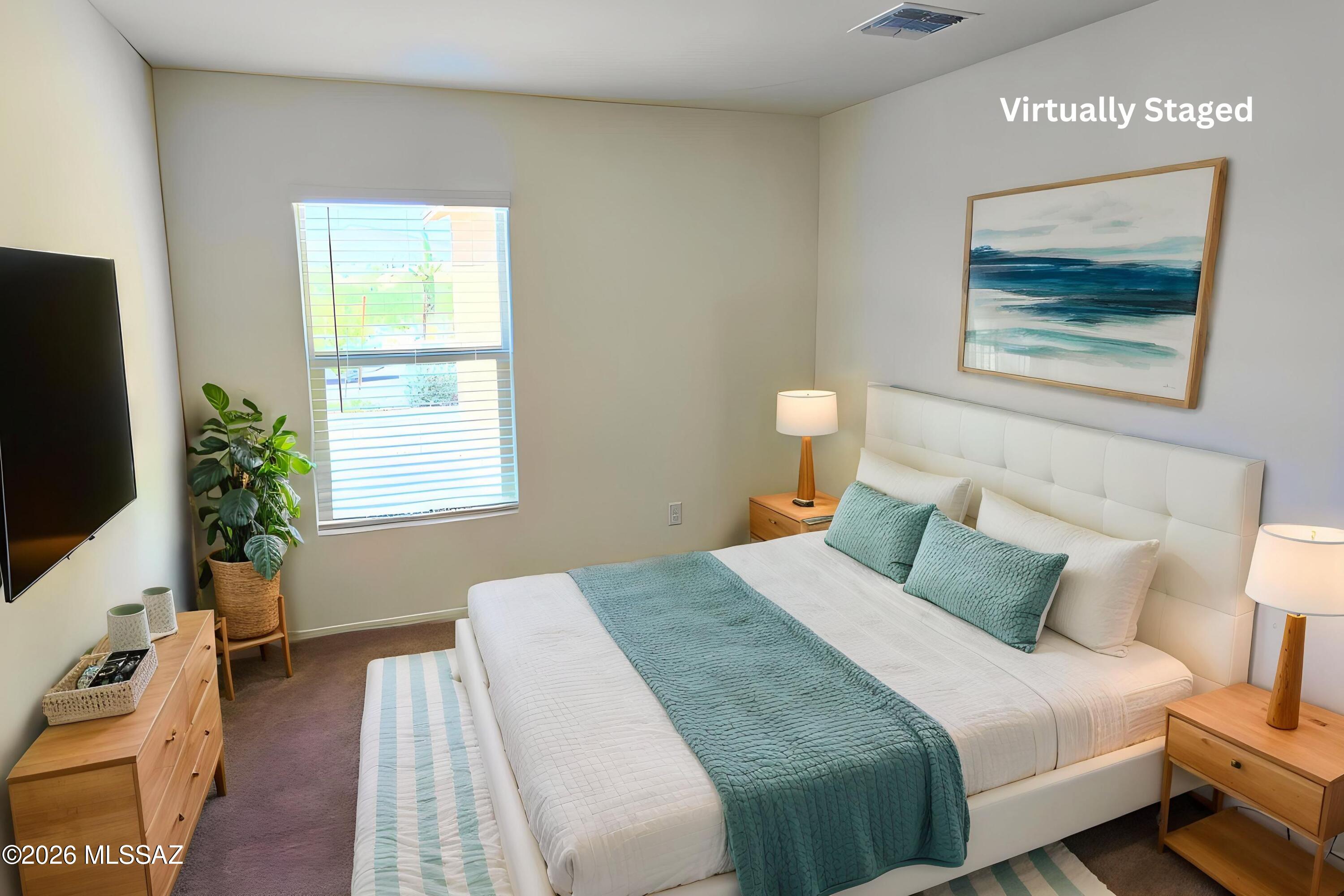6343 South Rigby Way Tucson, AZ 85746 - Photo 13 of 29 a bedroom with a bed and a flat screen tv