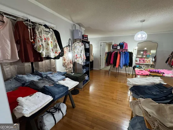 a view of a dining room with furniture and a window