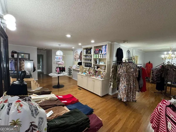 a living room with lots of furniture and gym equipment